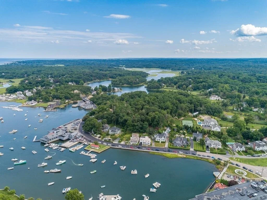 Cohasset lighthouse with copper dome overlooking the harbor